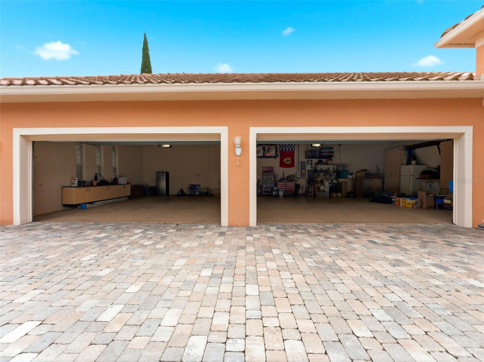 Oversized 4-car garage with storage cabinets