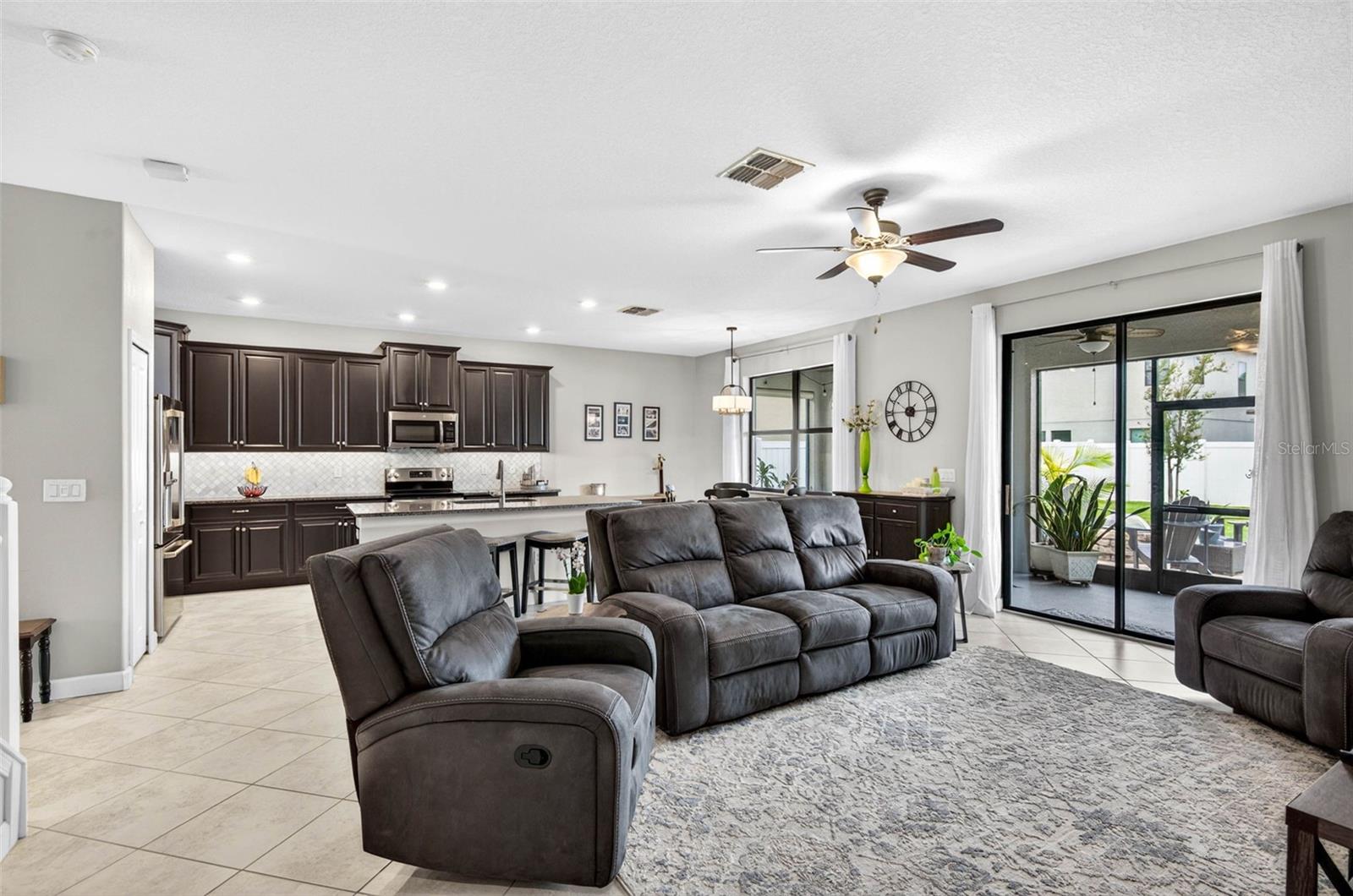 Large great room living area combined with kitchen area.
