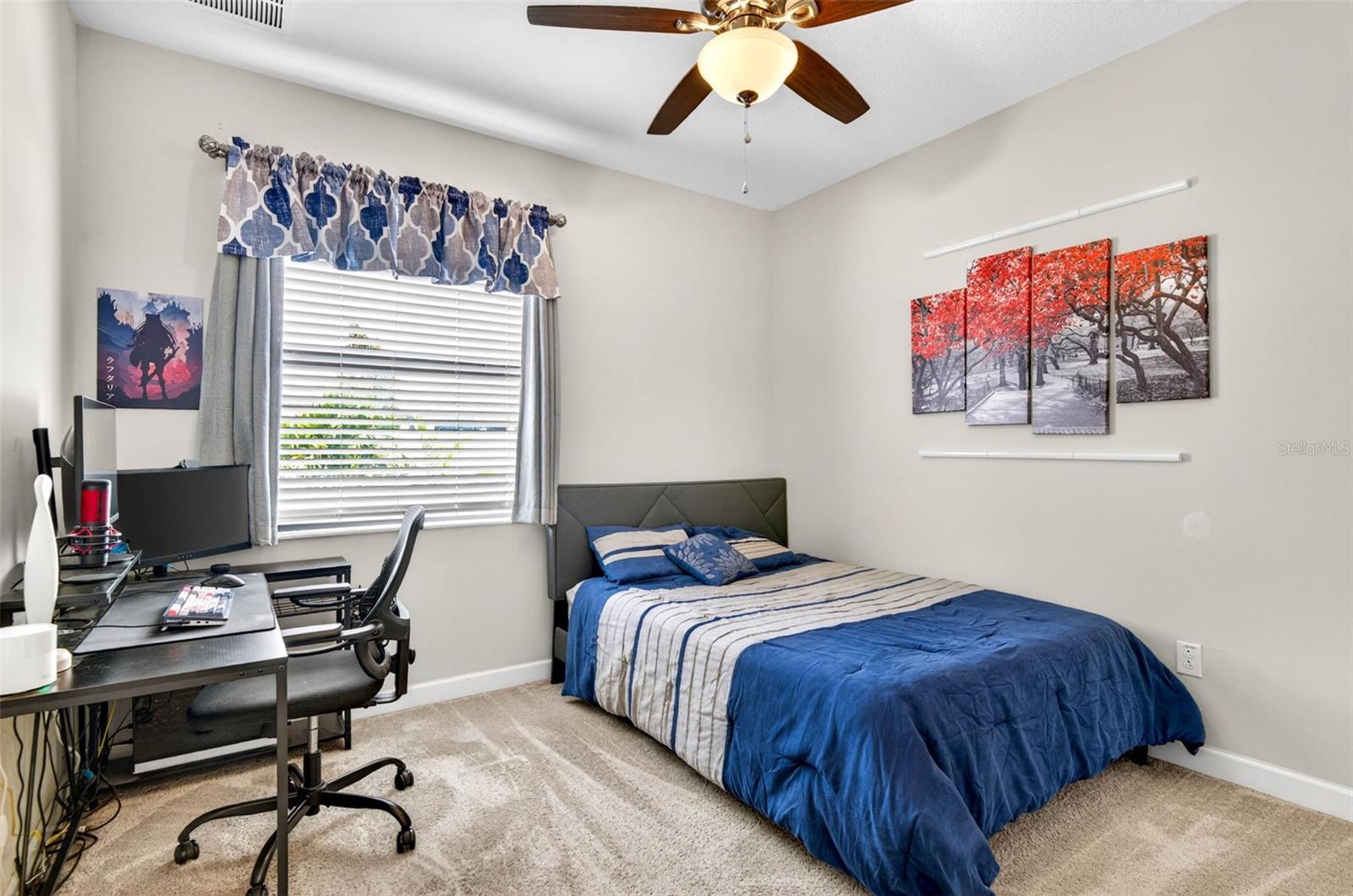 Downstairs bedroom with blinds and ceiling fan