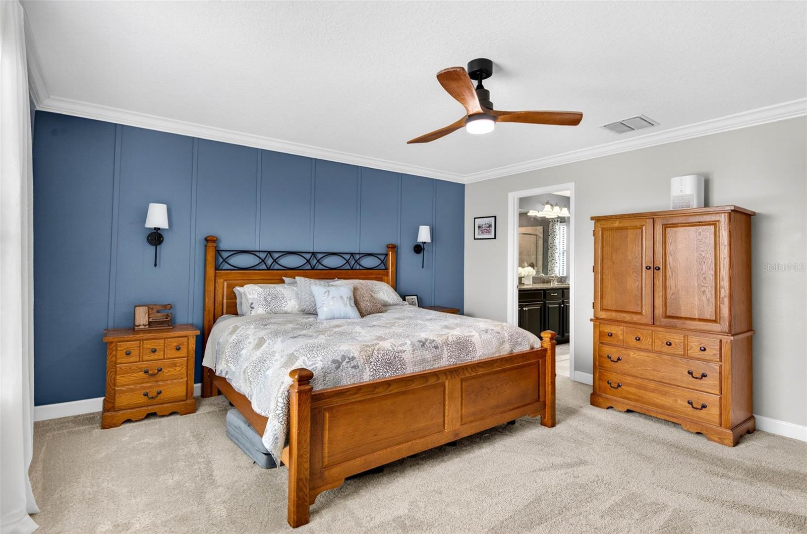 Primary Bedroom located upstairs with ceiling fan and en suite bathroom