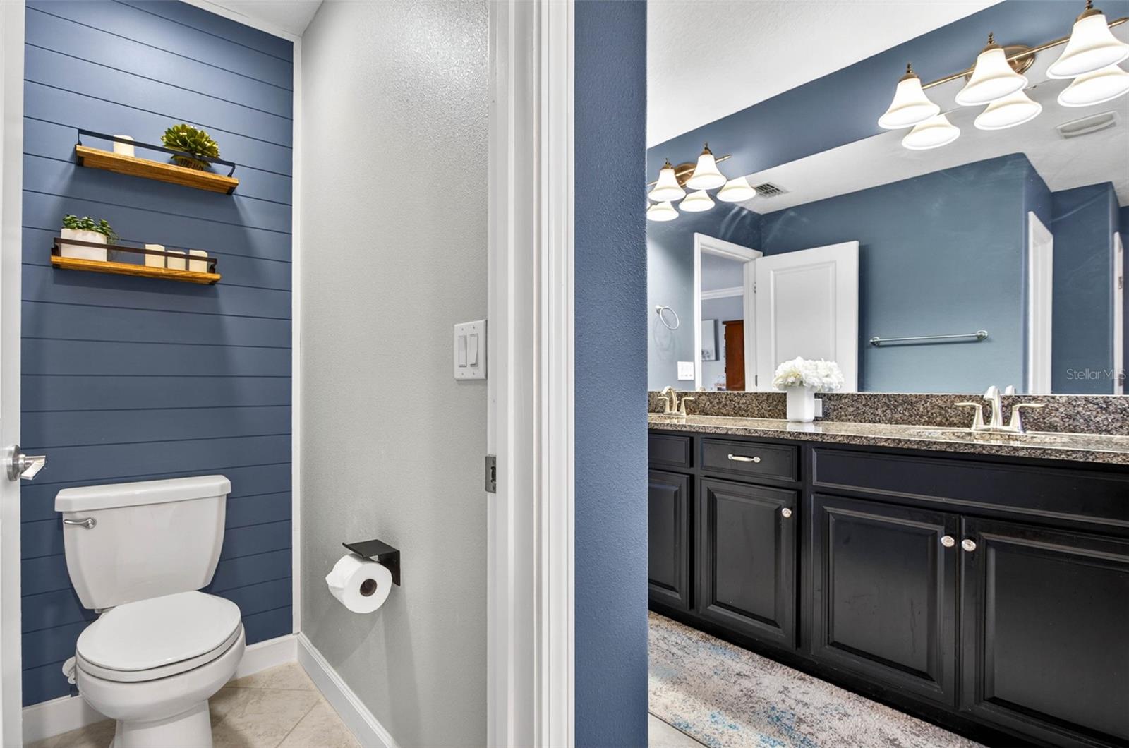 Primary, en suite bathroom includes a private wash closet.