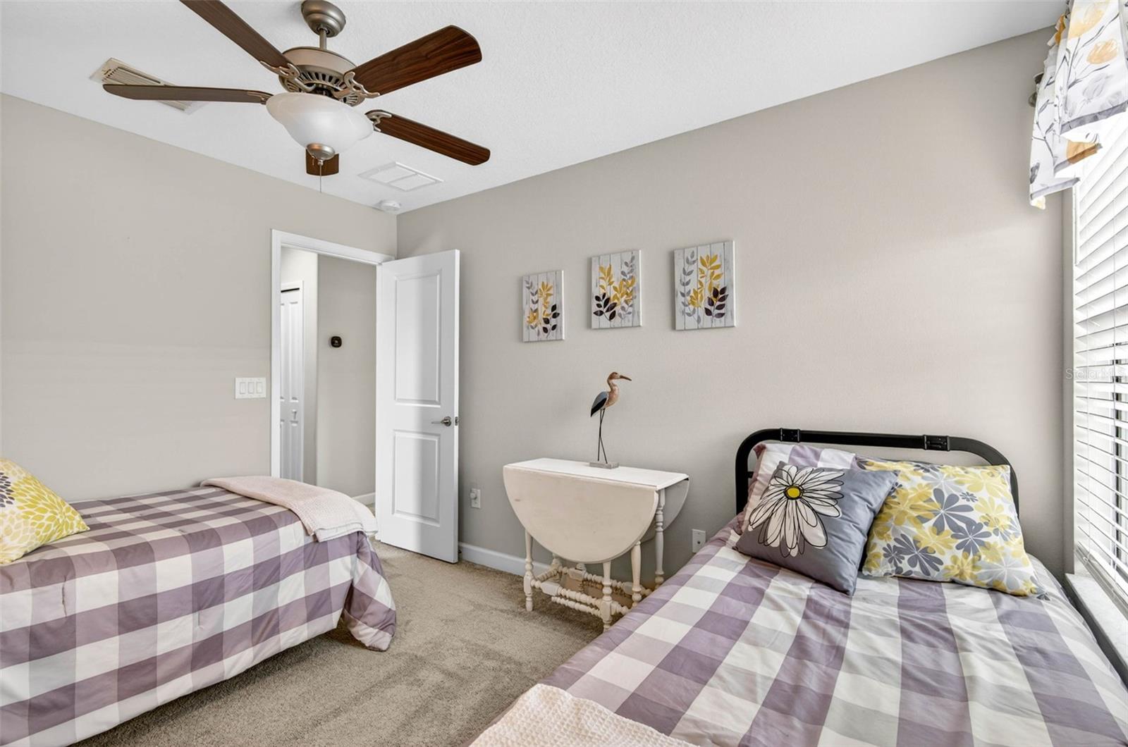 Upstairs bedroom complete with blinds and ceiling fan
