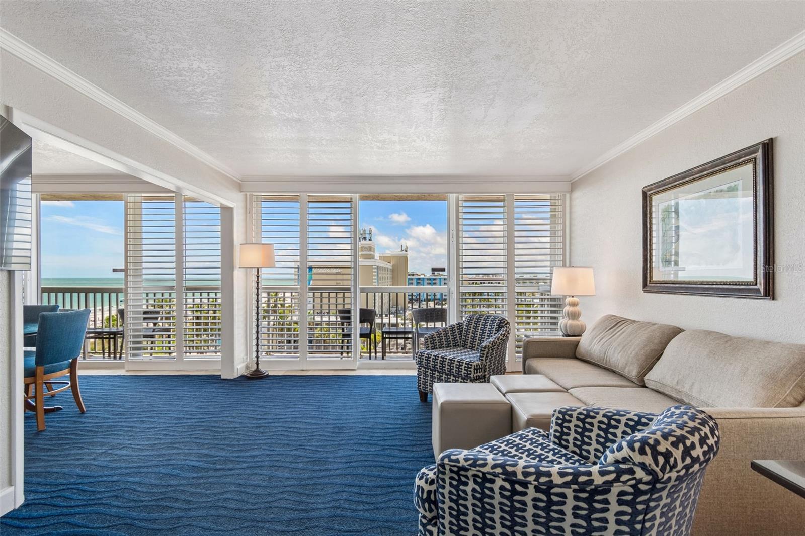 Enter to a living area with wall to wall sliders with water & resort views. Sleeper sofa to accommodate up to 8 guests
