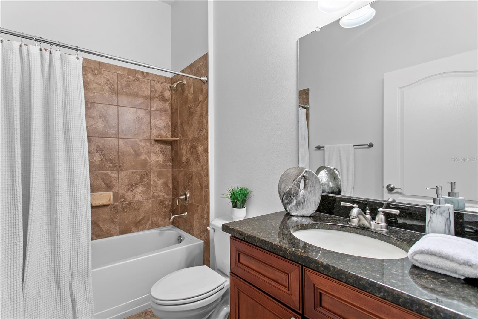 The first floor features a full bathroom