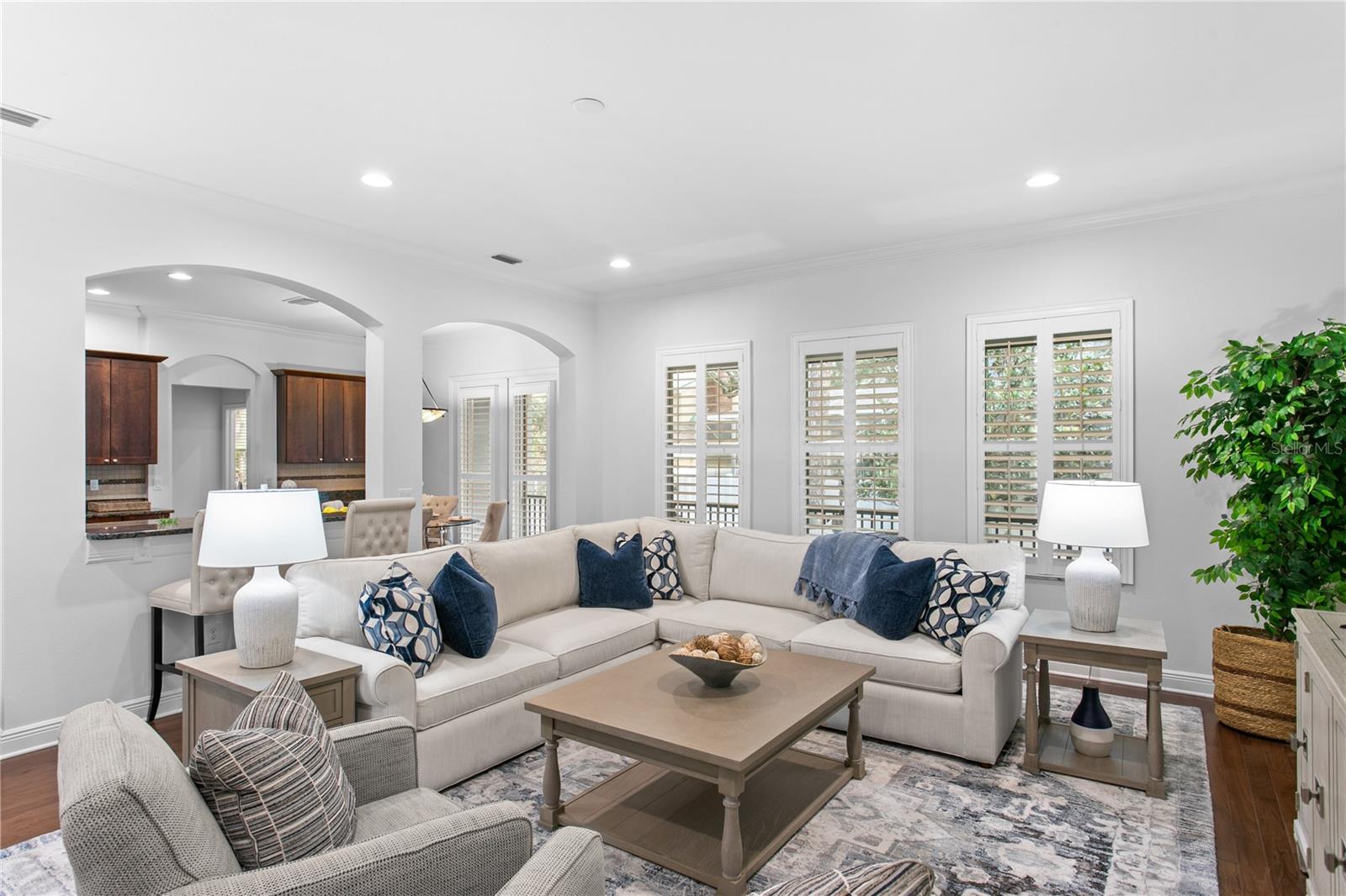 Open to the kitchen, the expansive family room serves as the heart of the home.