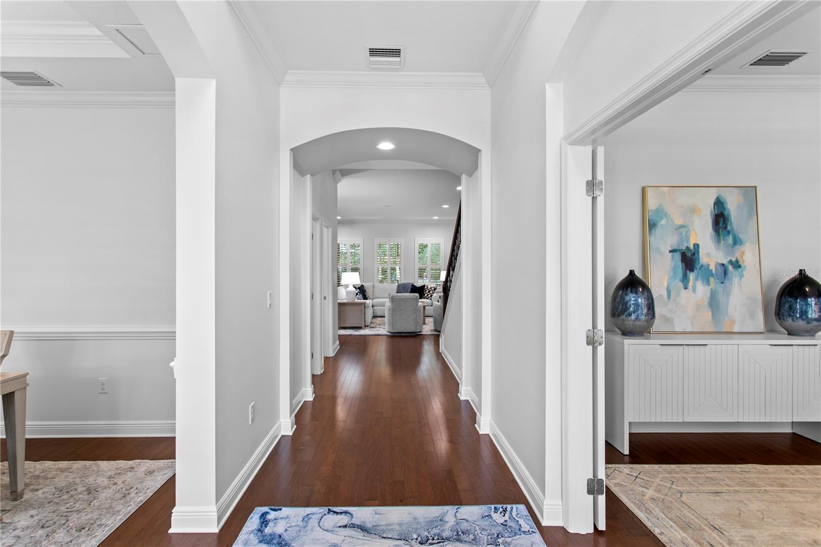 A grand entry with soaring ceilings sets the tone for the home