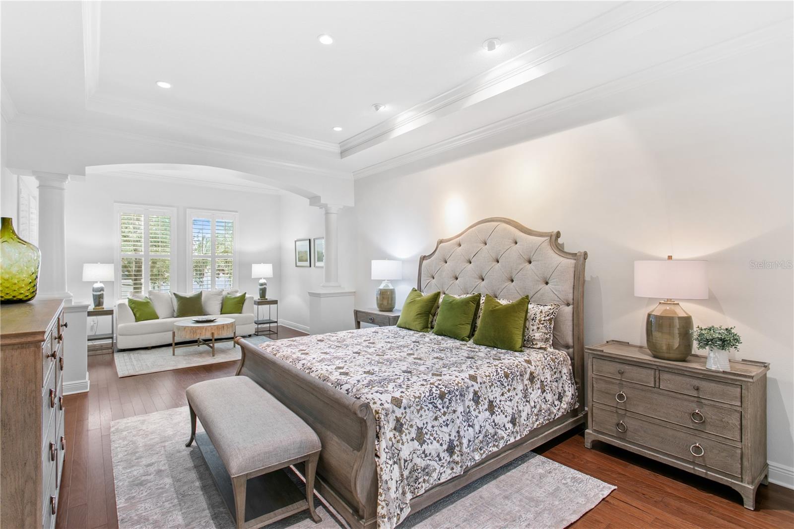 A rare first-floor primary suite provides a private sanctuary