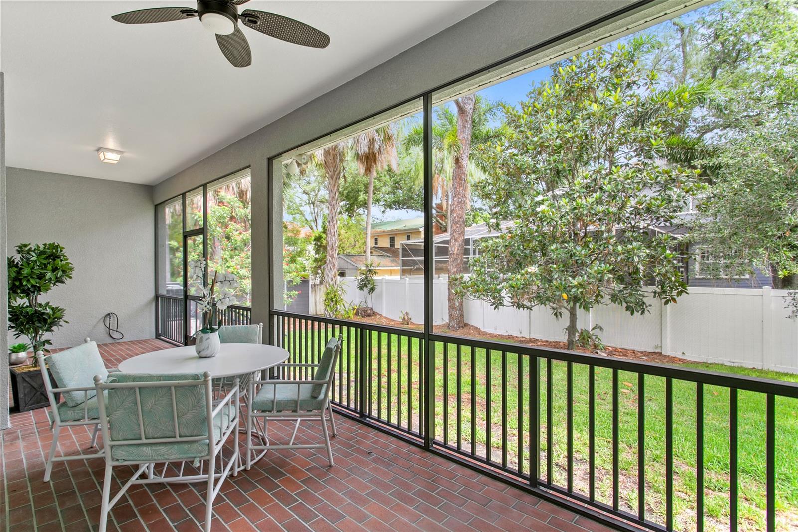 Enjoy direct access to the screened back porch from the spacious first-floor primary suite