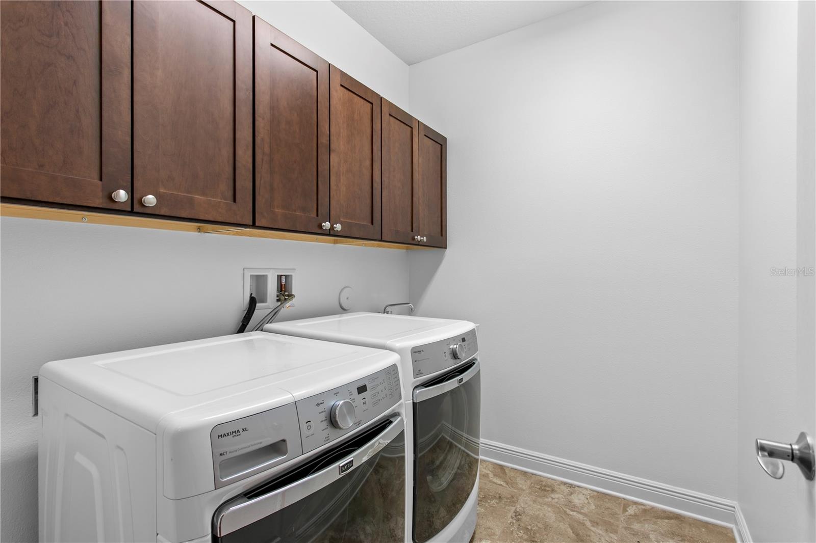 Completing the first floor is a well-positioned laundry room