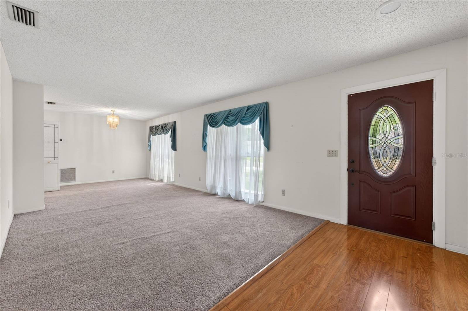 Front Entryway to Living Room/Dining Room-Brand New Carpet