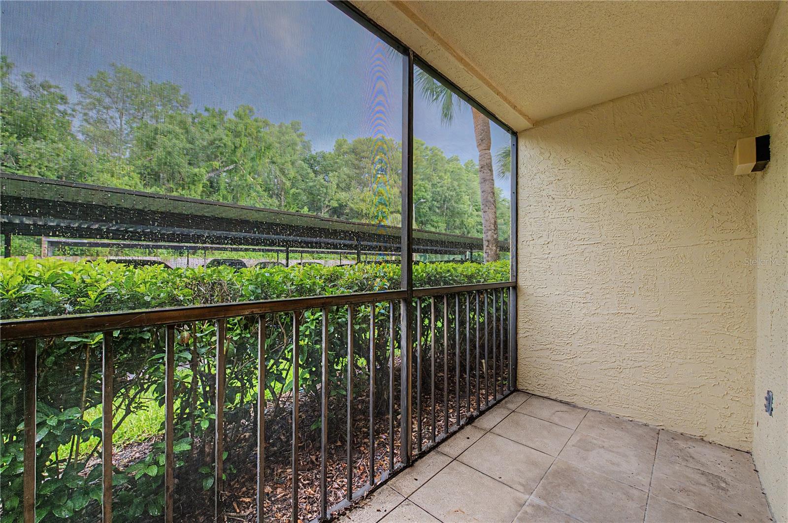 One of your two private, roomy SCREENED PATIOS! (This one is the primary bedroom's private patio!)