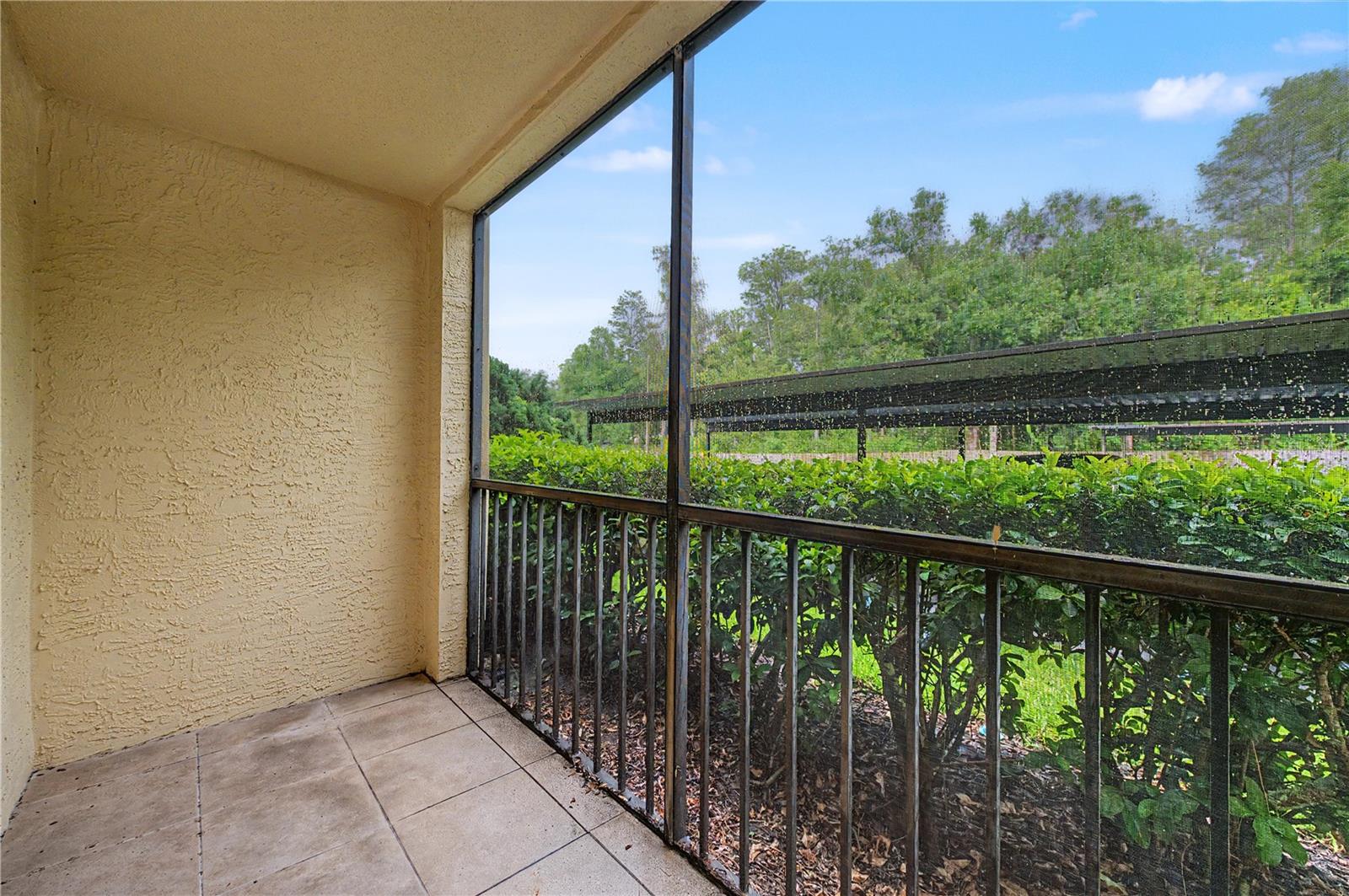 Private primary bedroom's patio space! Very roomy and it's screened!