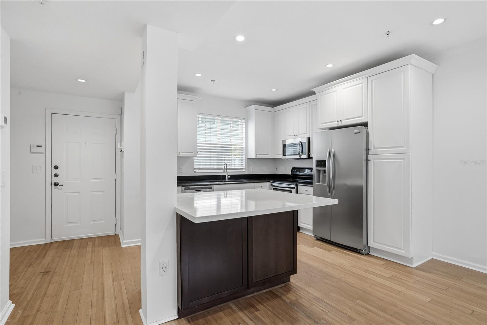 Kitchen and the door leads to the pool and Hyde Park Village
