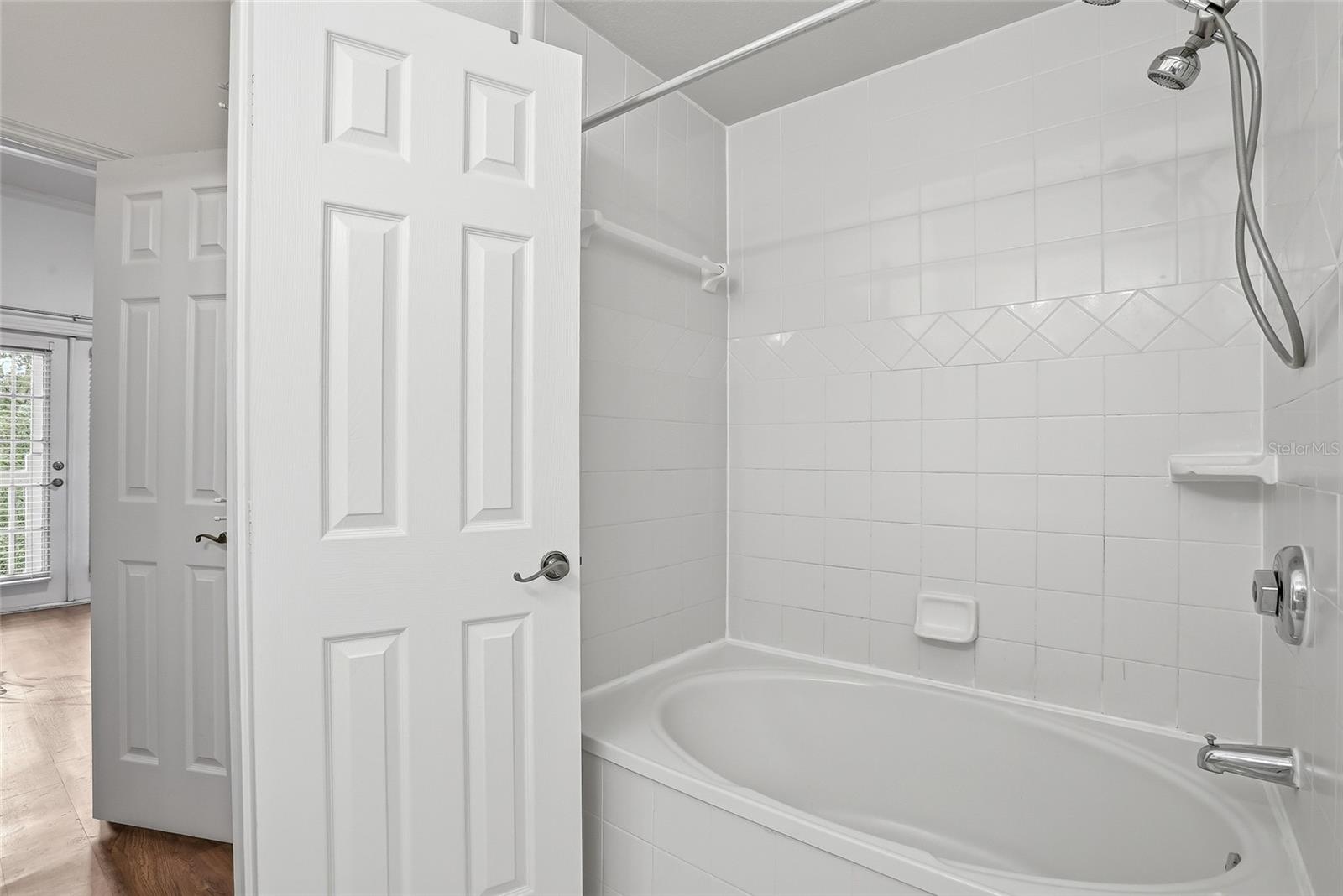 primary bathroom with a large vanity