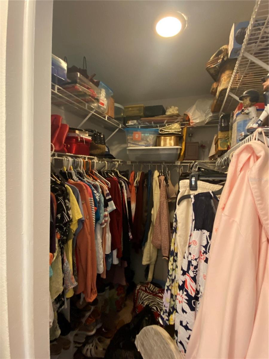 Primary bedroom walk-in closet