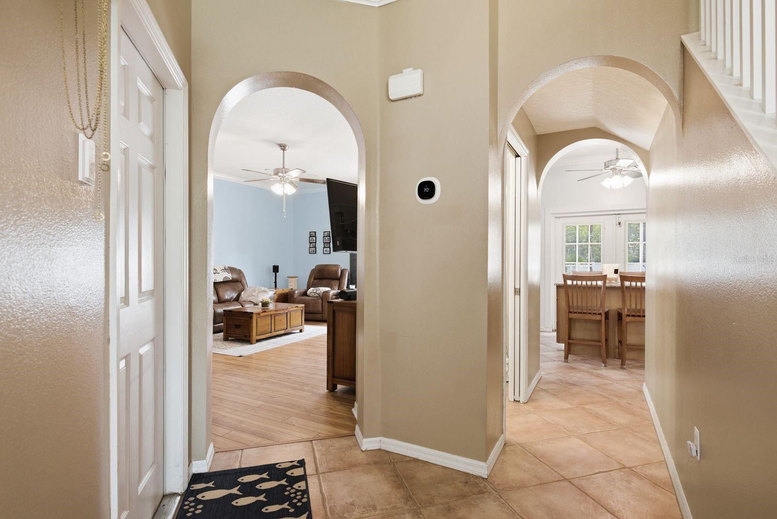 hallway from front door into living room and kitchen