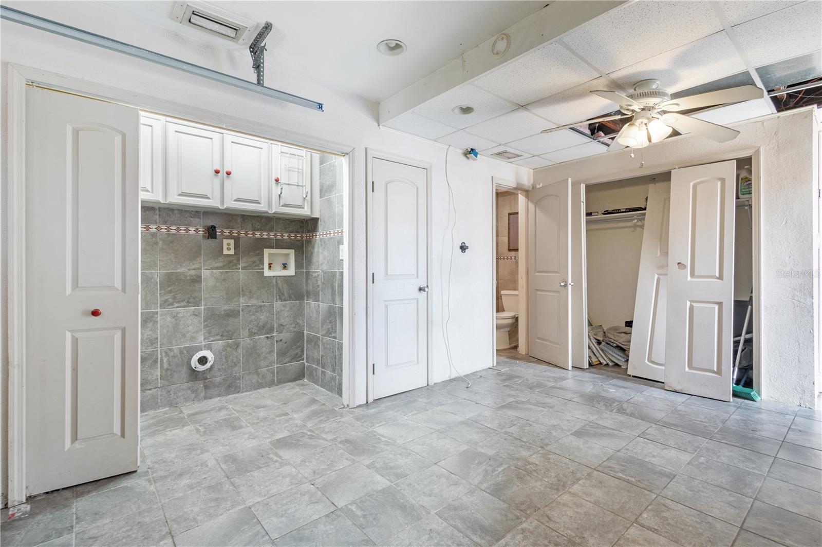 Garage converted to ADU with half bathroom and laundry hookup.