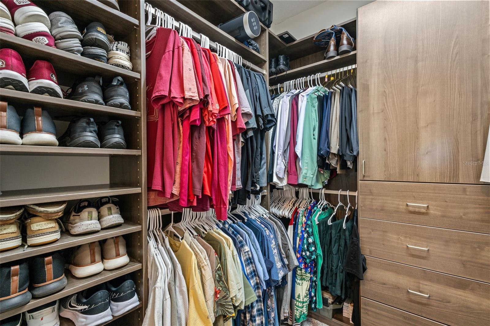 Walk-in closet with custom built-in cabinetry