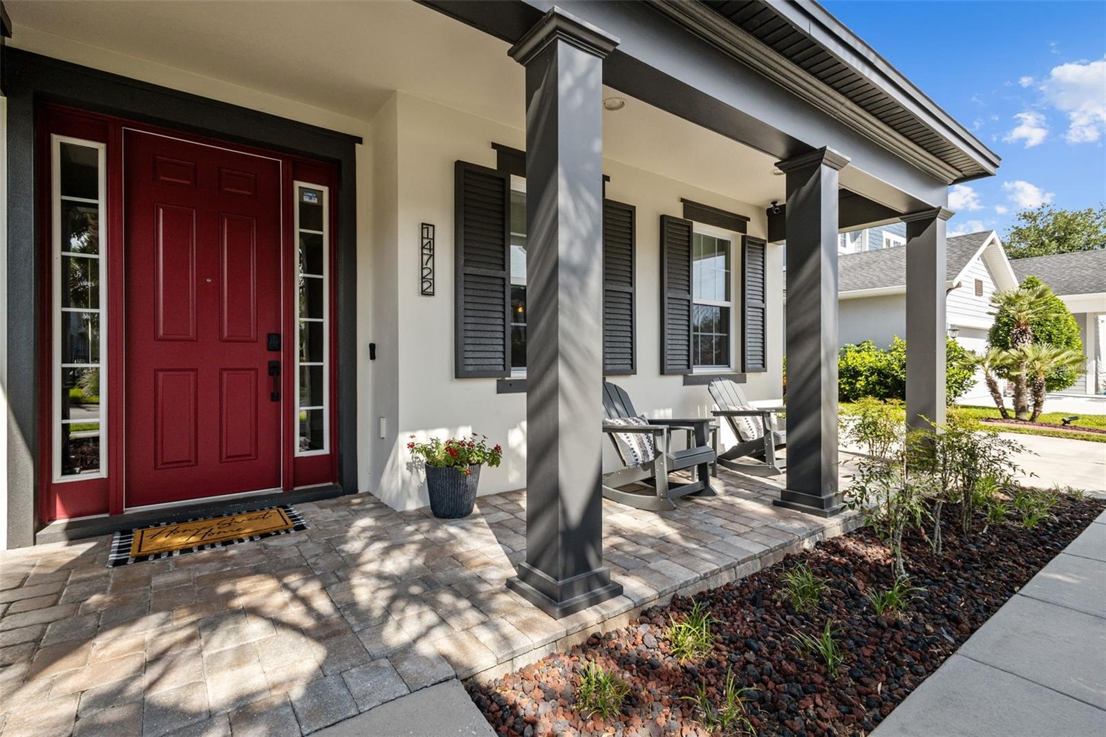 Pavered front porch with room for seating