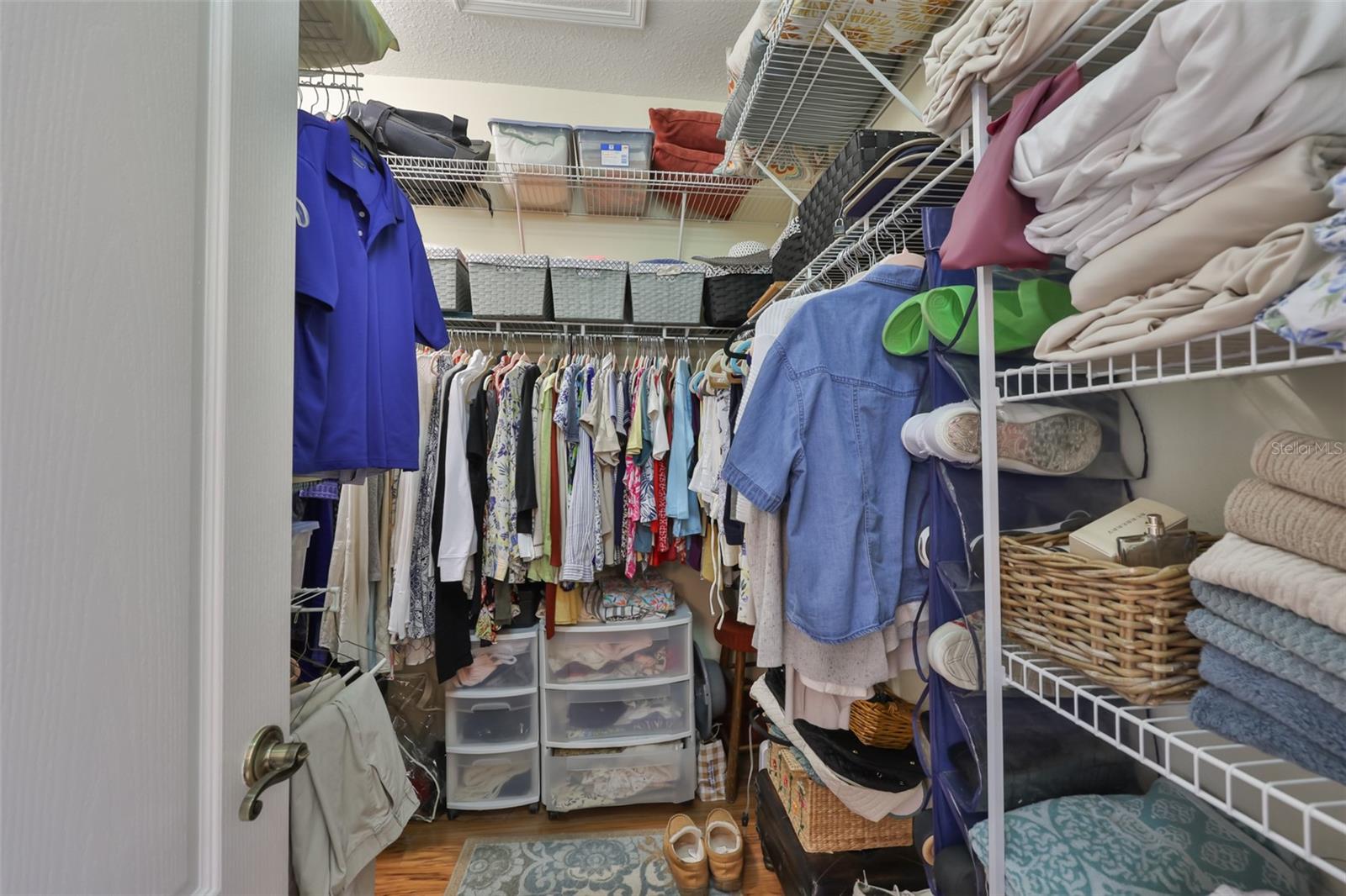 Master walk in closet, it looks larger in person.