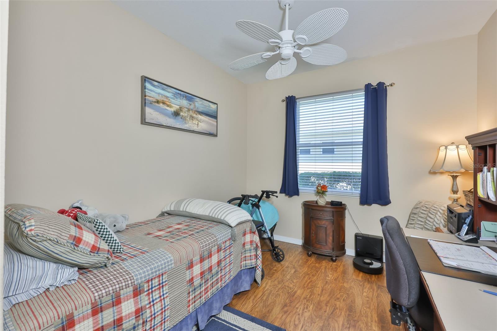 This is a third bedroom or den. The entrance has double doors.
