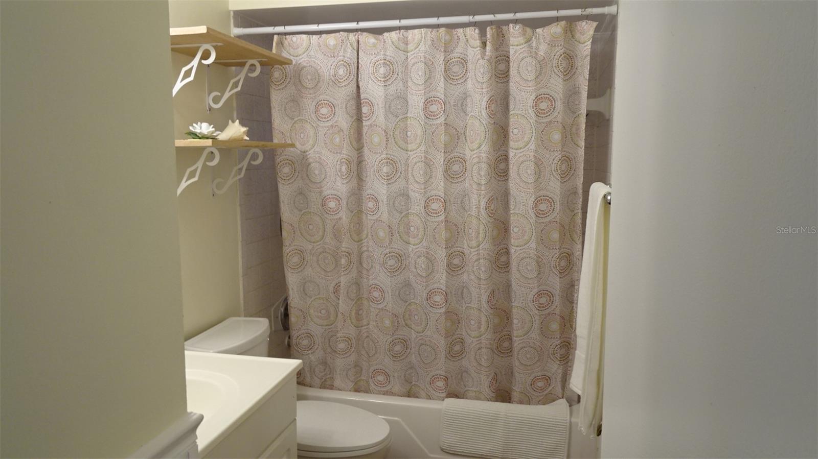 Guest bathroom next to primary and bedroom #2.