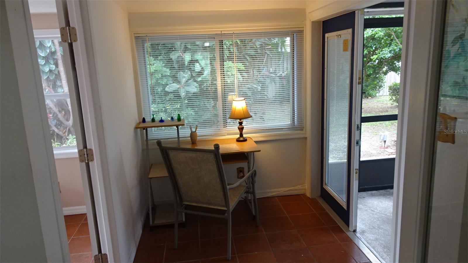 Room to the left is the 3rd bedroom, also terra cotta tile floors.