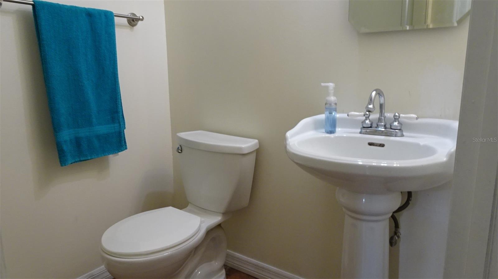 Full bathroom with shower in large utility room.