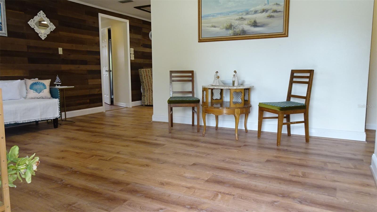 New Luxury Vinyl plank flooring, shiplap wall accent.