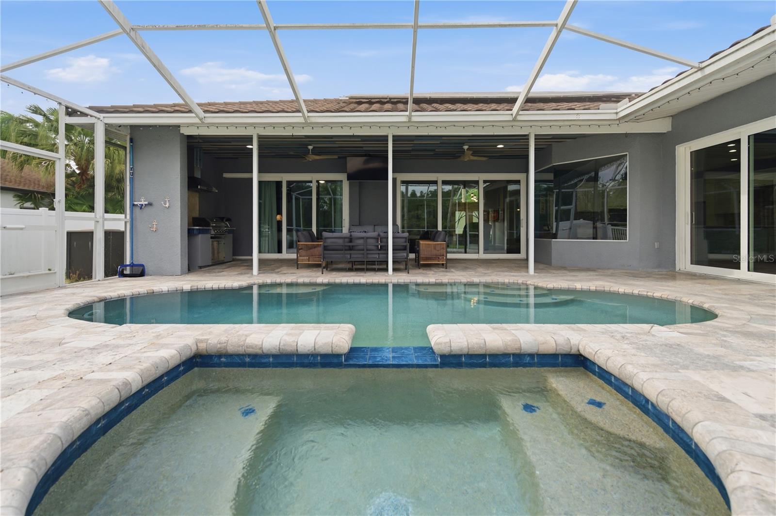 View from the Sauna of the Covered Pool Patio and Outdoor Kitchen