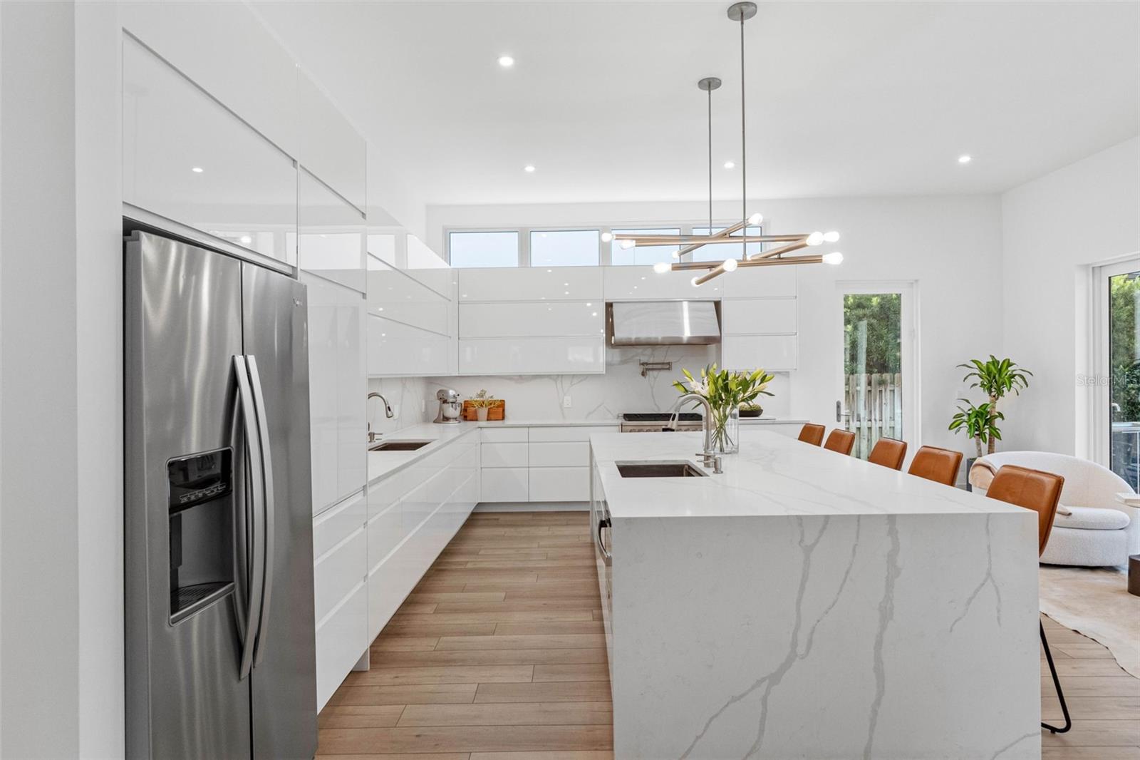 Custom kitchen boasts solid drawer cabinetry system for functionality, Bloom soft closure hinges, cabinet to store everyday appliances, 2 sinks with disposal, 6 burner 36" Fulgor Milano, professional hood among other features.