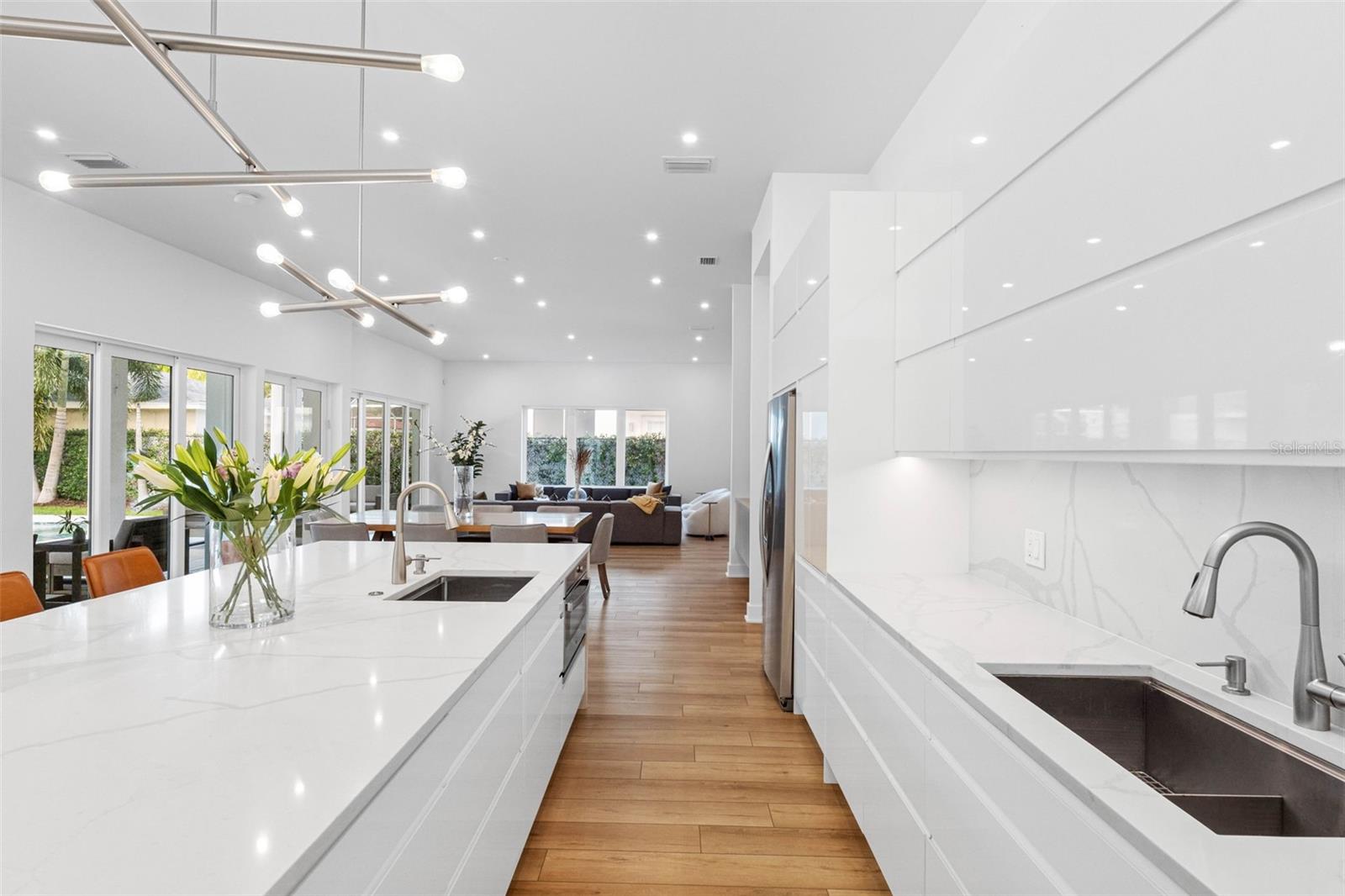 Custom kitchen boasts solid drawer cabinetry system for functionality, Bloom soft closure hinges, cabinet to store everyday appliances, 2 sinks with disposal, 6 burner 36" Fulgor Milano, professional hood among other features.