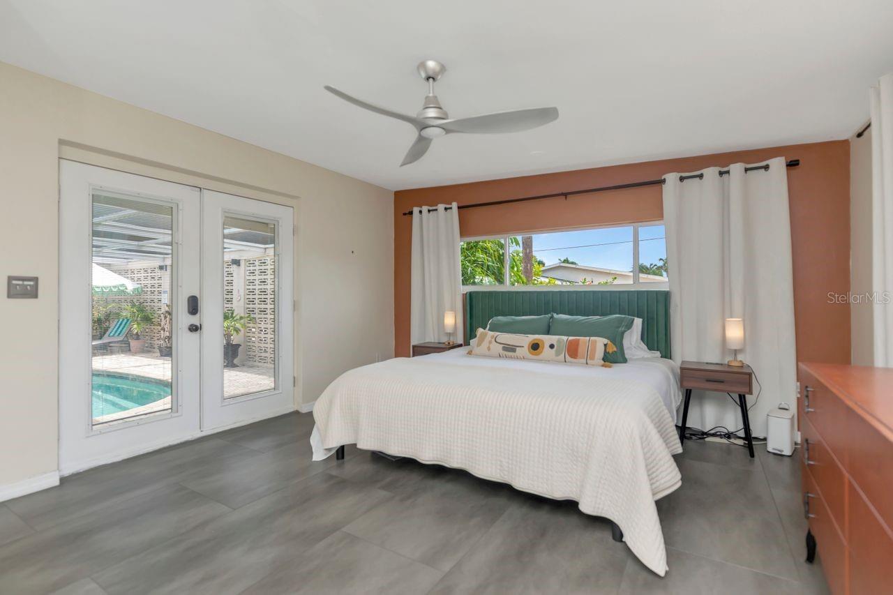 Large primary room with view of the pool