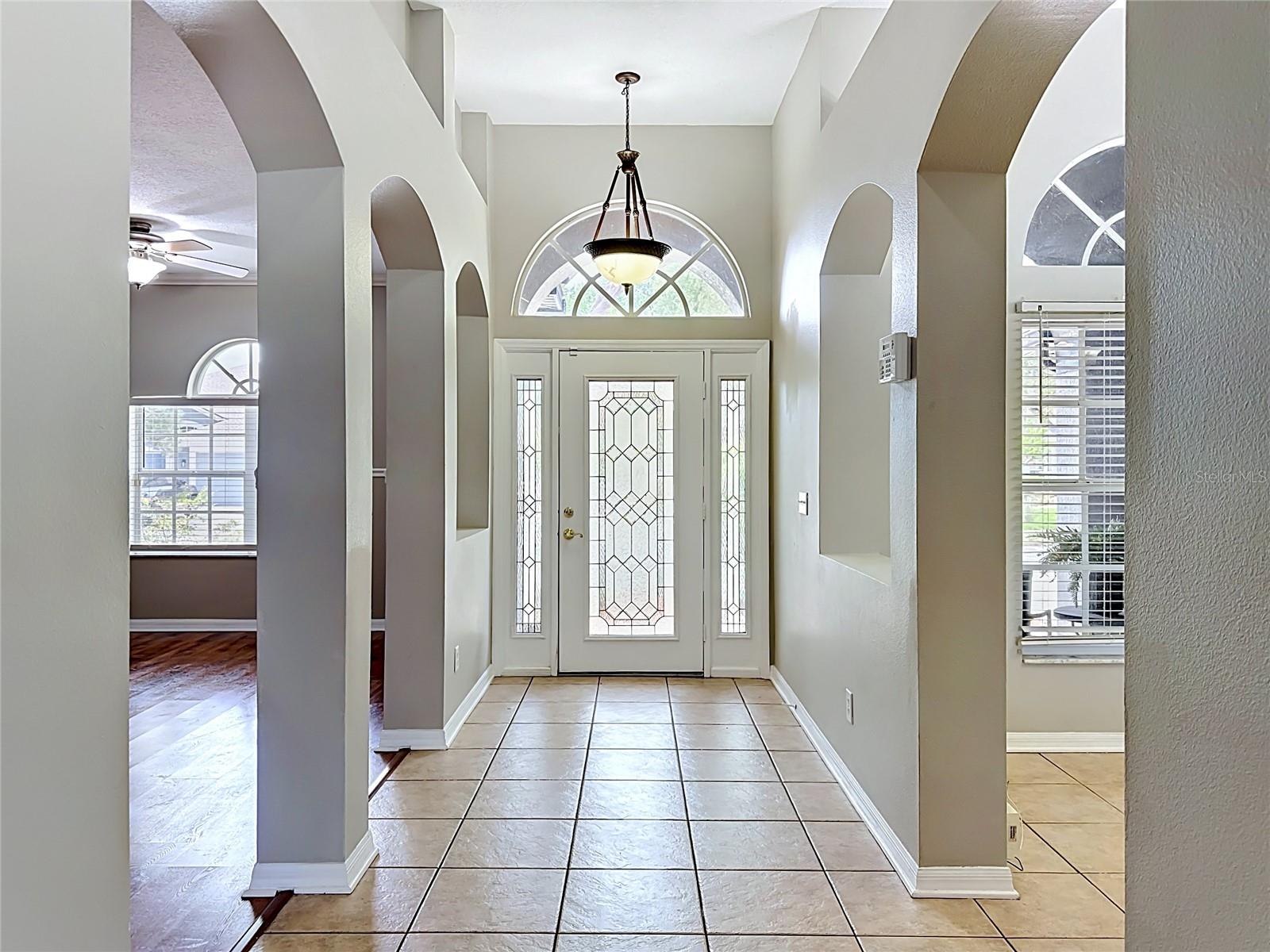 Entry hall flanked by living room and breakfast room