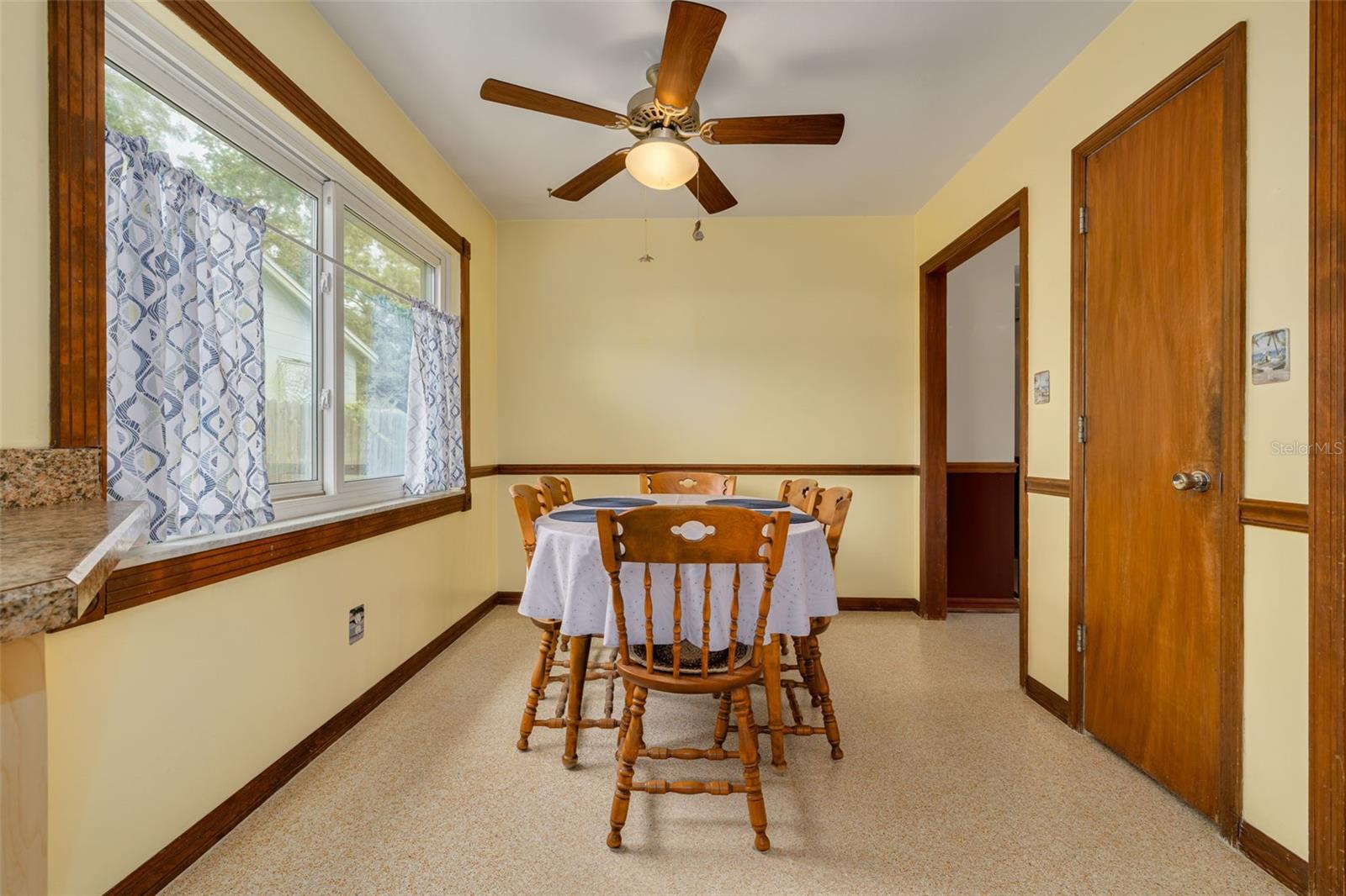 Dining area overlooking side yard