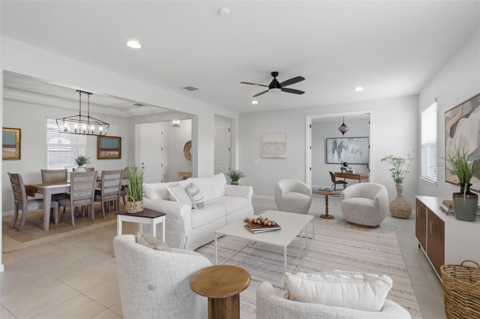 This thoughtfully designed living and dining room combination maximizes space and functionality while maintaining an open, airy feel.