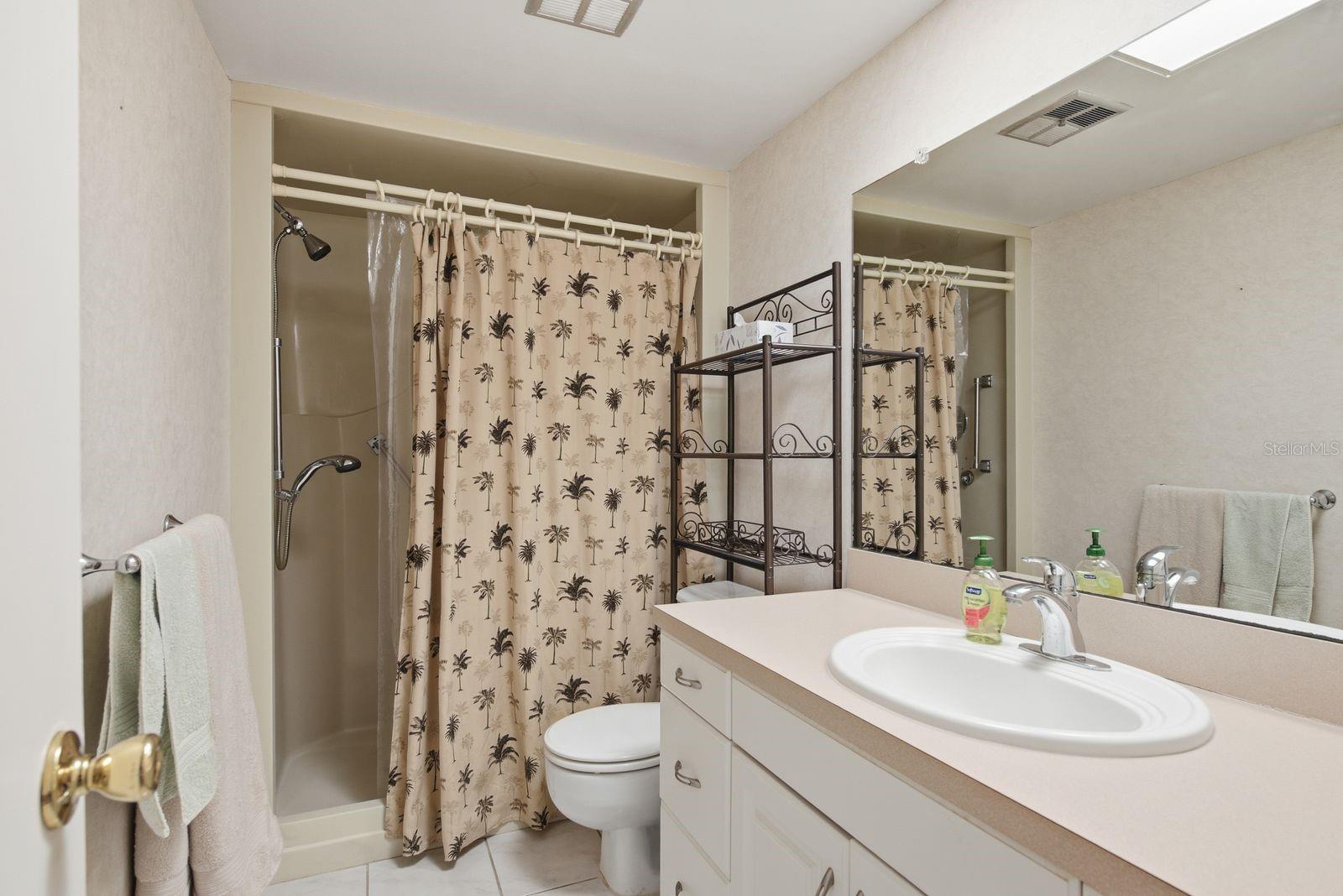 Guest Bathroom with shower with seat