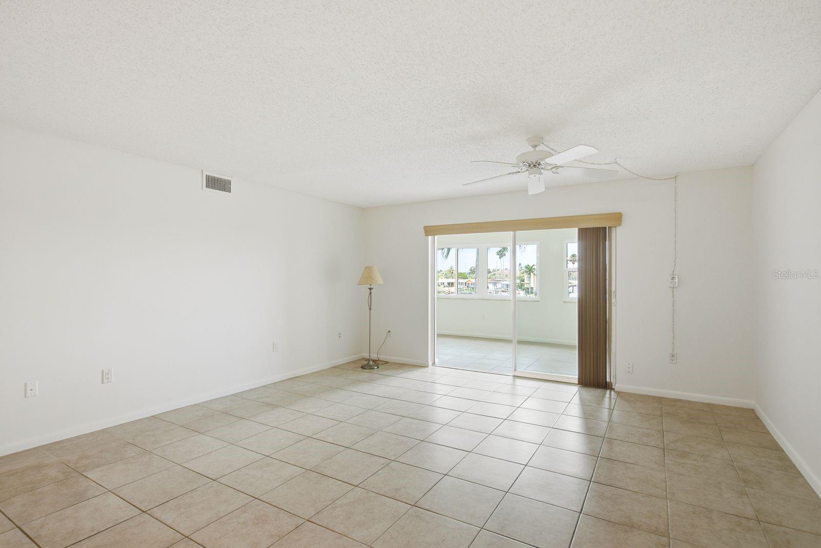 Living Room with view of Florida Room and Hurricane Rated Windows