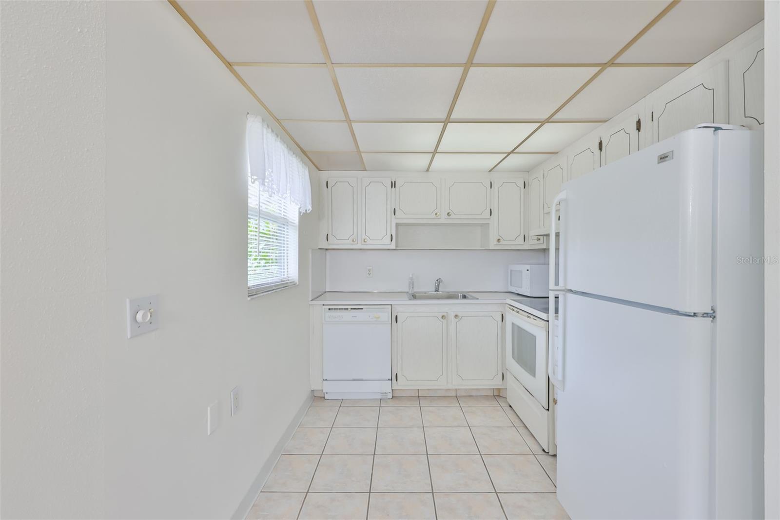 A small bistro table could easily fit into this bright kitchen.
