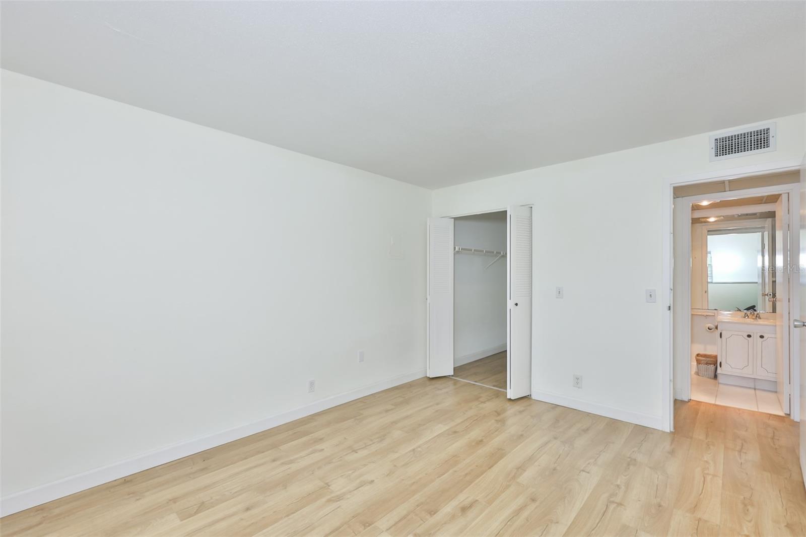 Primary bedroom is very spacious with a large walk-in closet.