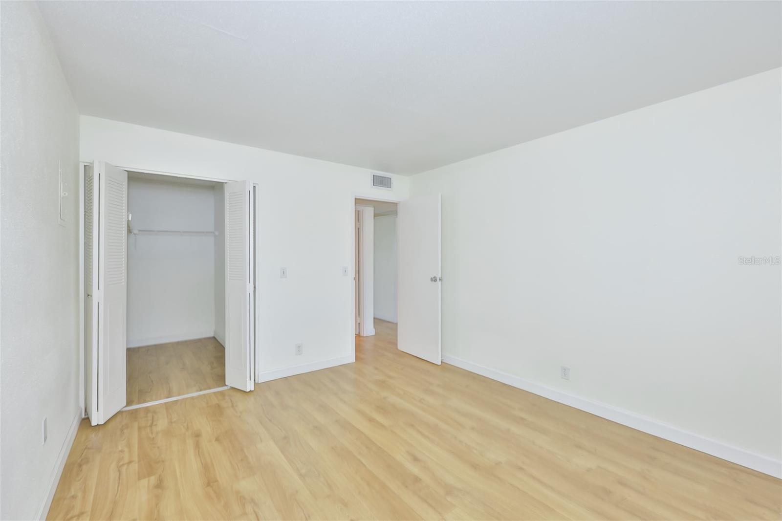 A large walk-in closet is perfect for storage needs.