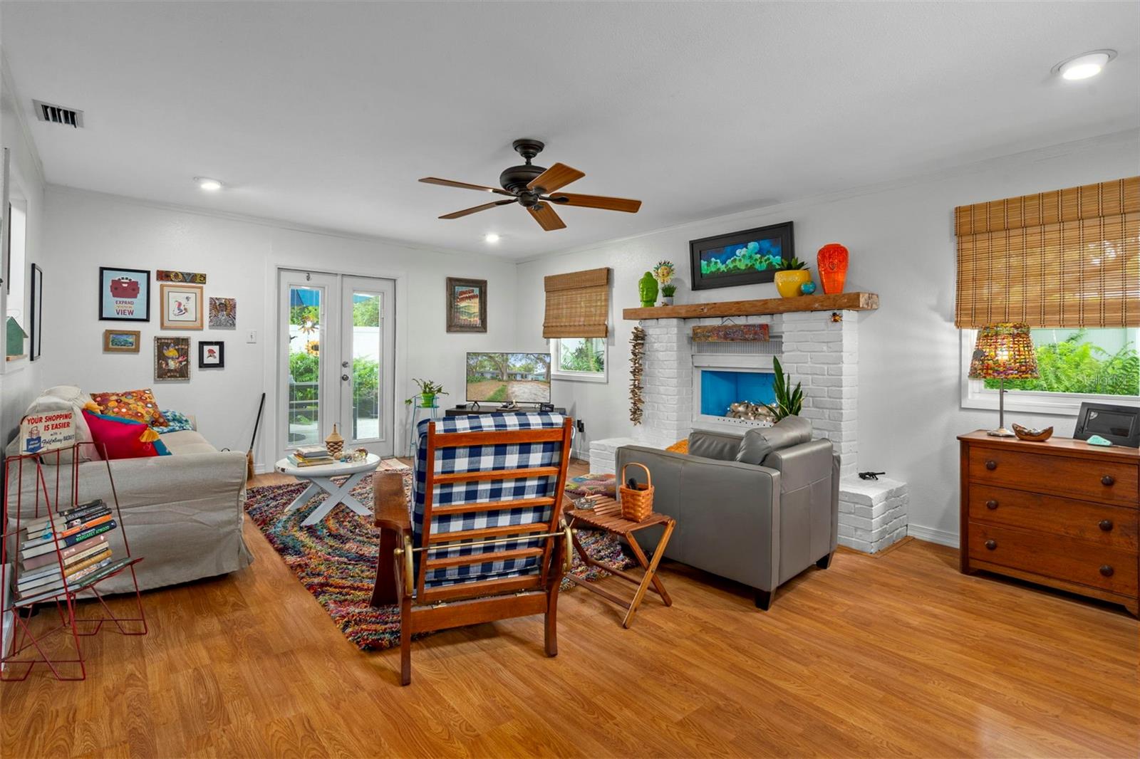 Relax in the family room with decorative fireplace and access to back patio through French Doors