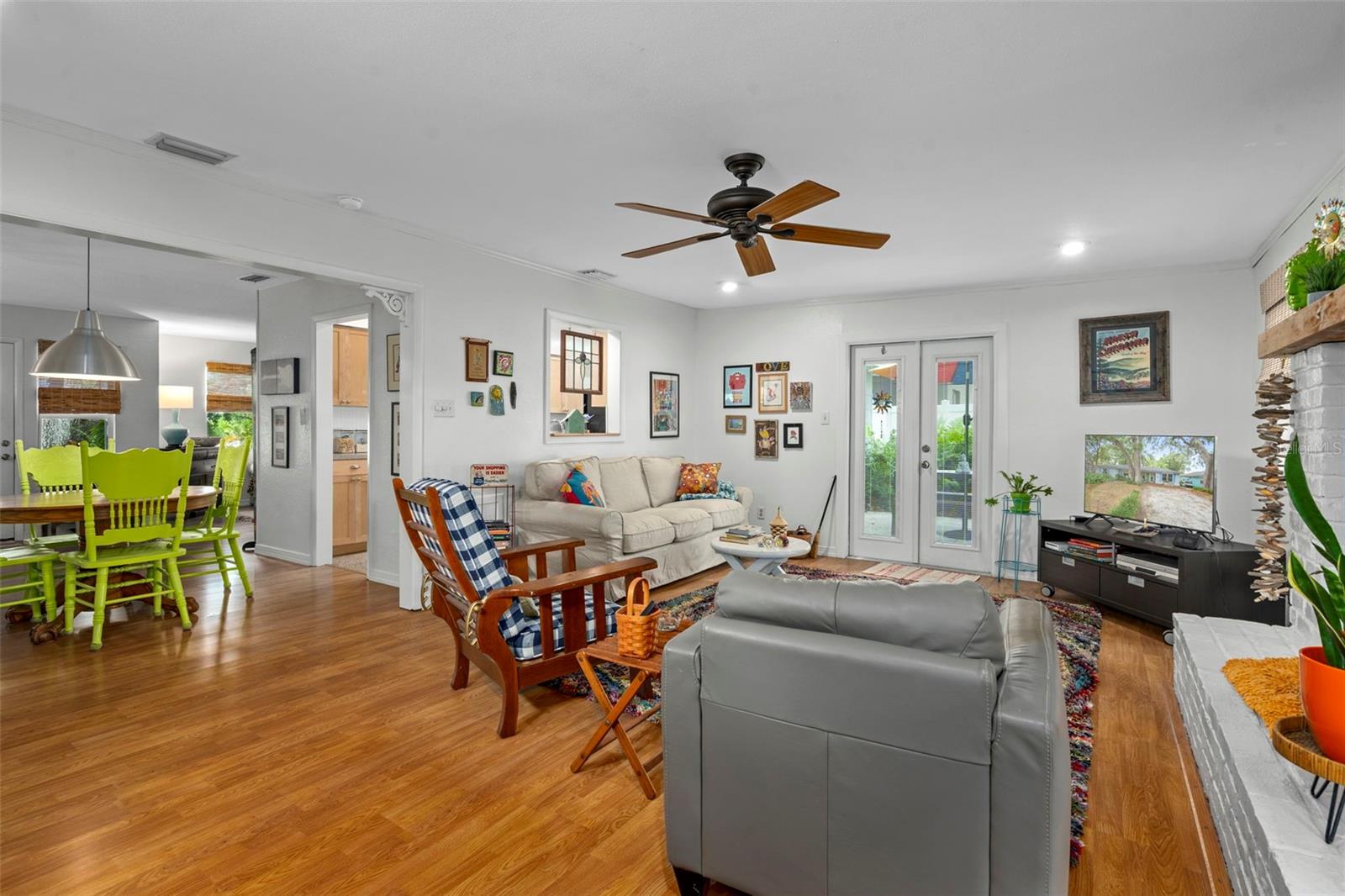 Full view of family room and dining area off kitchen.  Window box opening from kitchen to family room.