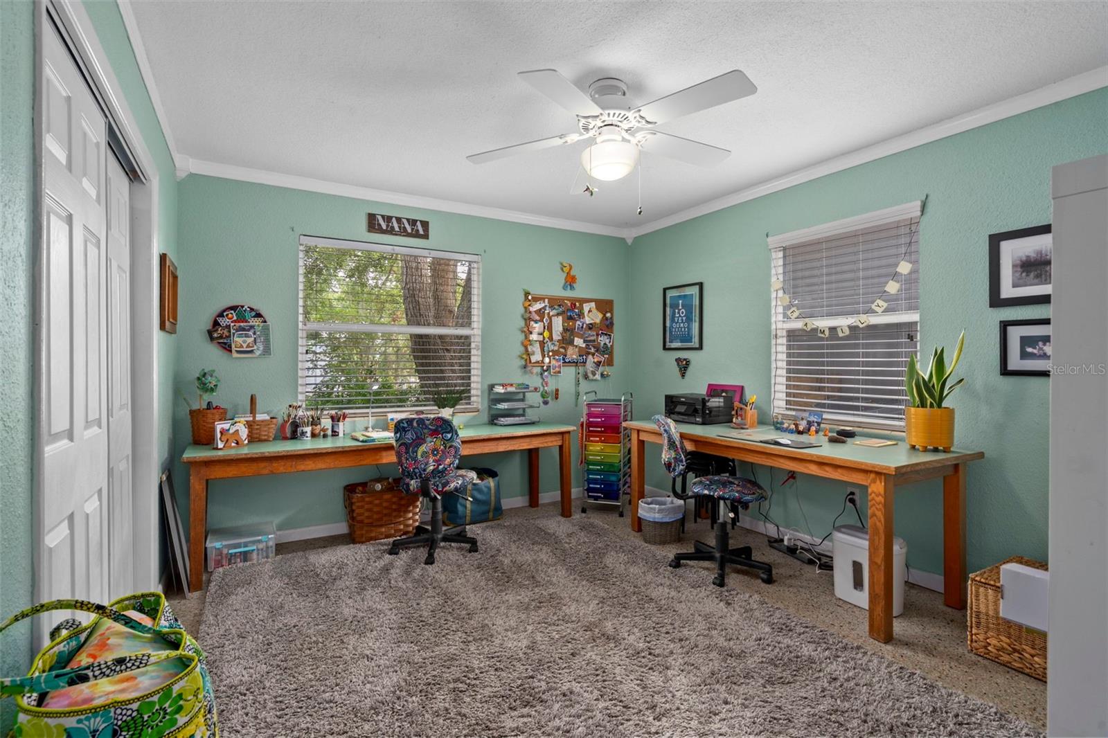 Bedroom 2 is situated at the front of the house and has crown molding and a huge closet!