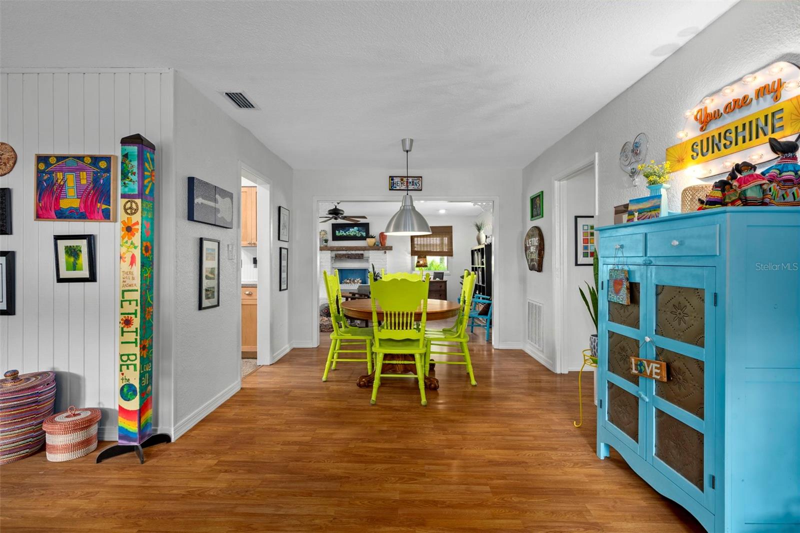 View straight back into home as you enter through front door.  Dining room with family room beyond and kitchen to left.