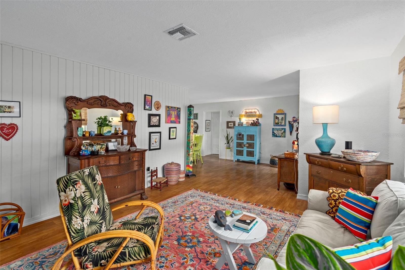 Main living area with shiplap style wall covering