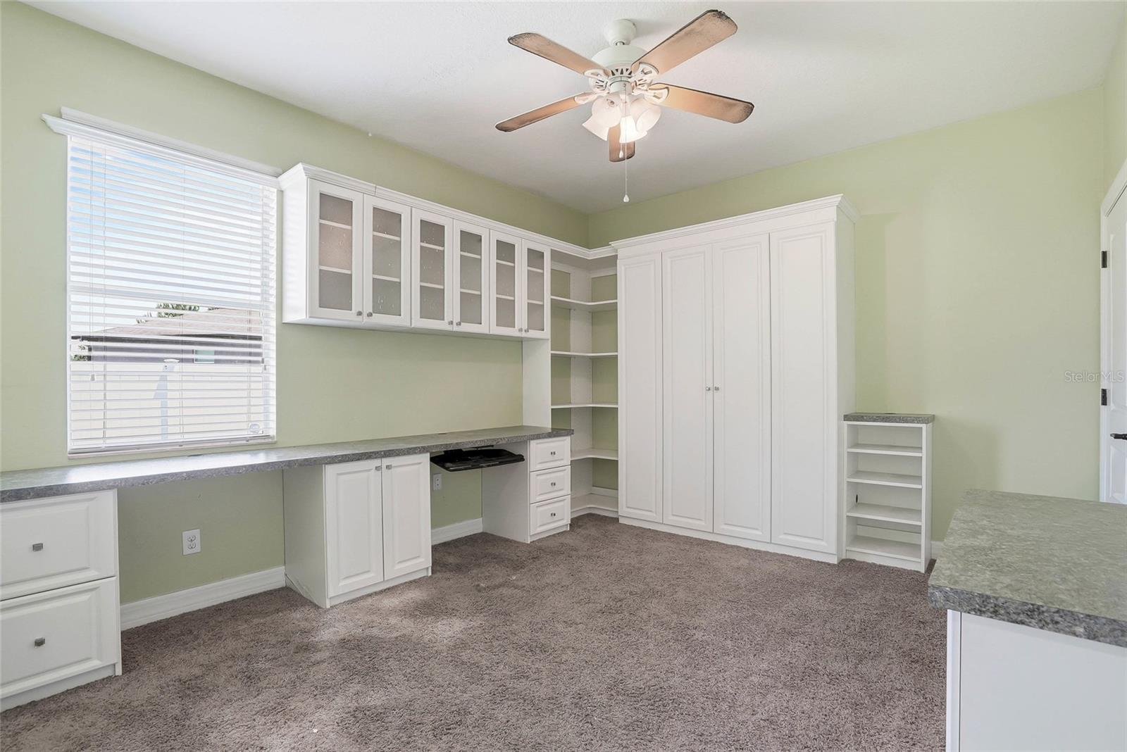 First floor bedroom with Murphy bed and built in desk space