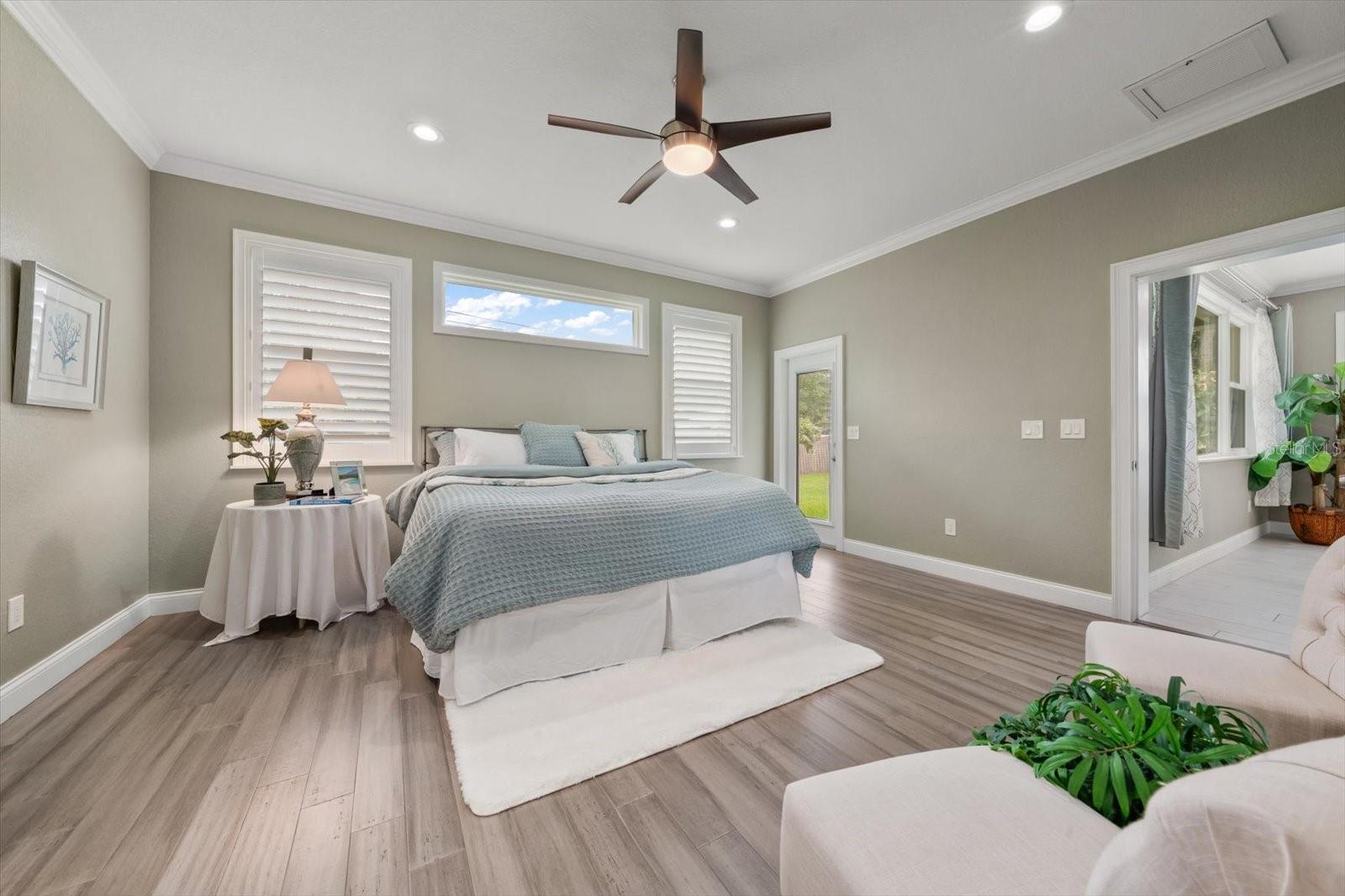 Primary bedroom has private access to pool, patio and backyard.