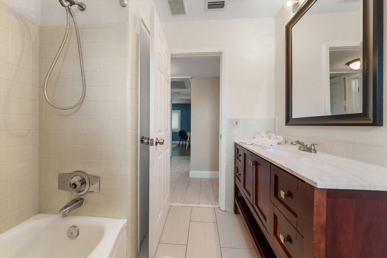 Third bath that services bathrooms 3 and 4