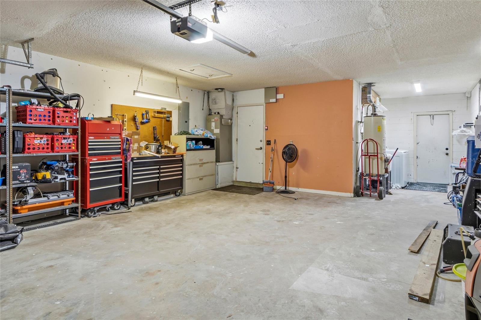 Laundry Area Located In Garage